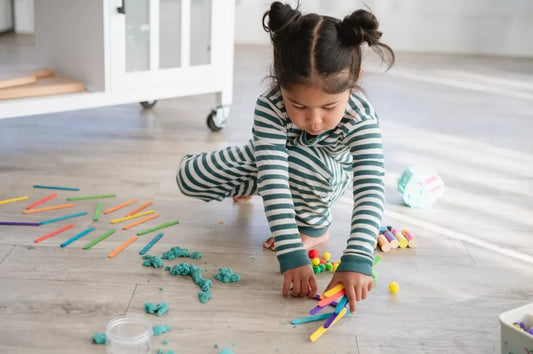 child playing with meemzy magic birthday gift sensory toy bin