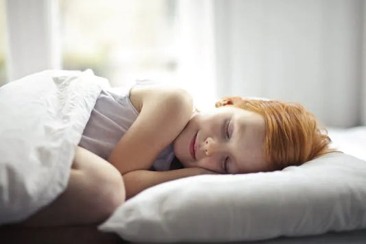 a child peacefully sleeping after calming quiet time routine.
