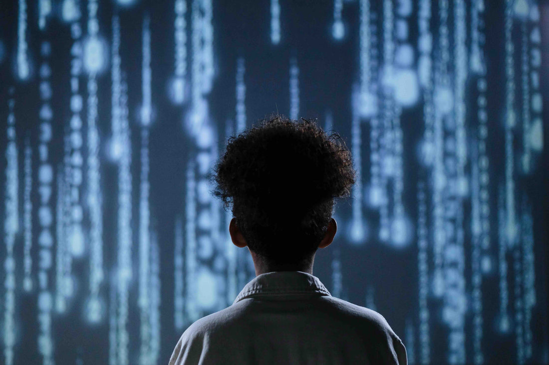 boy looking into large screen