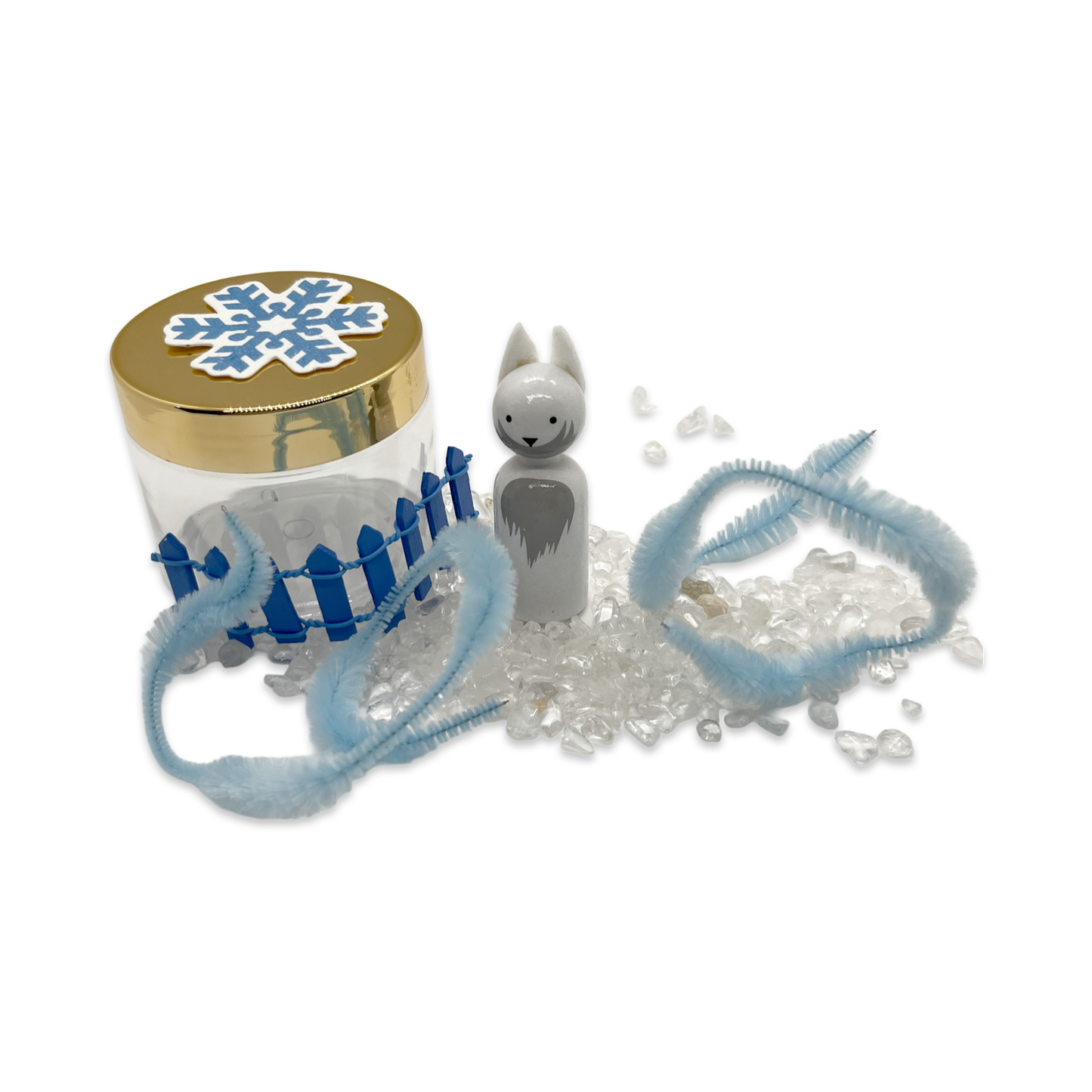 White arctic fox, seed paper snowflake, clear crystals, and fluffy blue pipe cleaners