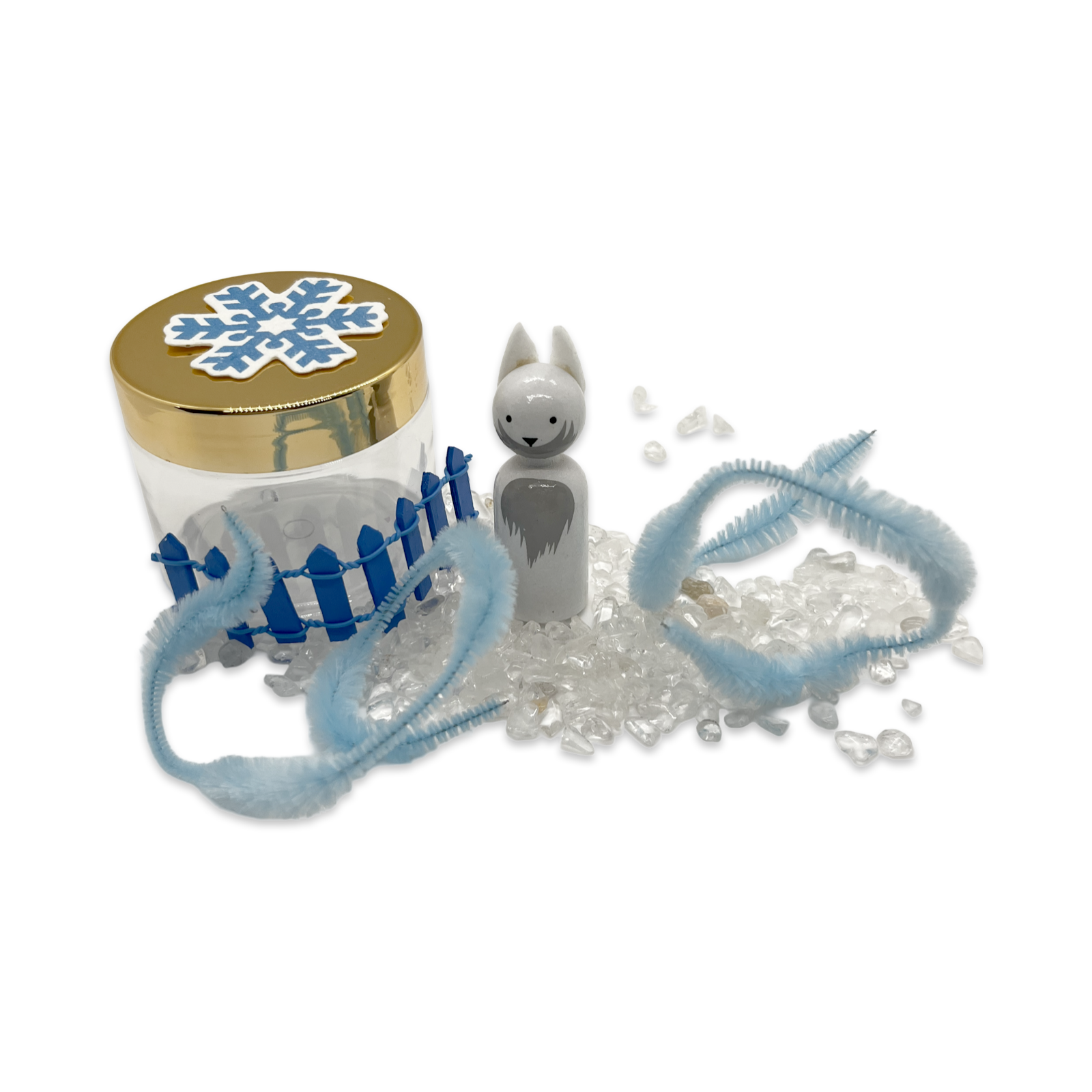 White arctic fox, seed paper snowflake, clear crystals, and fluffy blue pipe cleaners