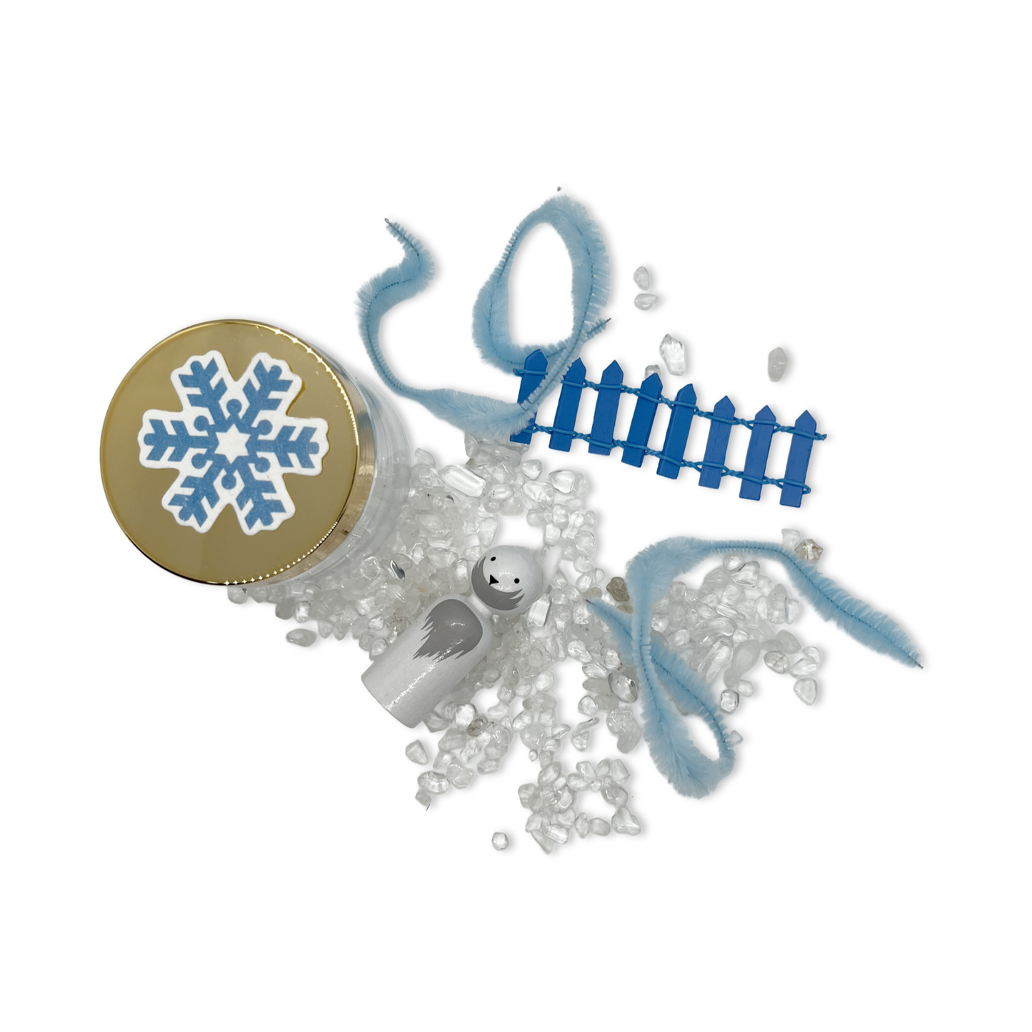 White arctic fox, seed paper snowflake, clear crystals, and fluffy blue pipe cleaners