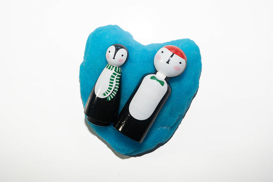 Penguins with green bow tie and scarf.
