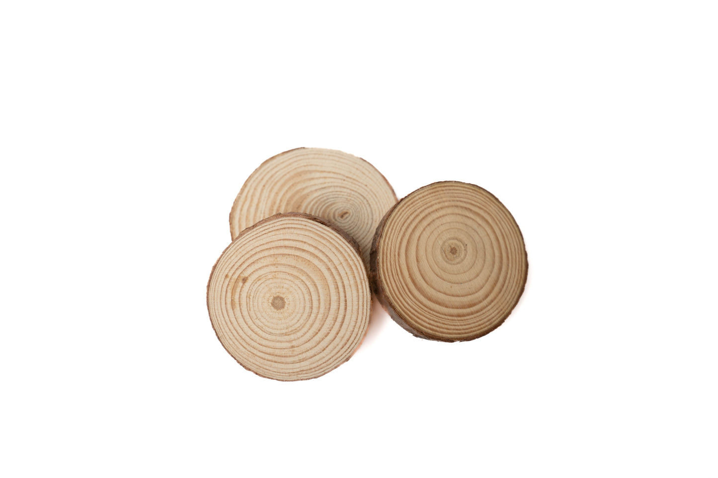 natural wood rounds laying in a pile. (3)