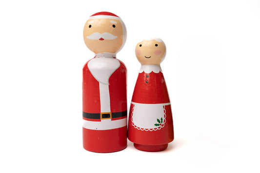 Hand painted red and white wooden Santa Claus and Mrs. Claus
