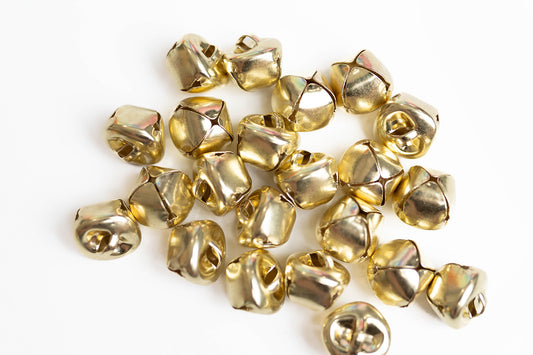 Overhead shot of gold mini Christmas  jingle bells