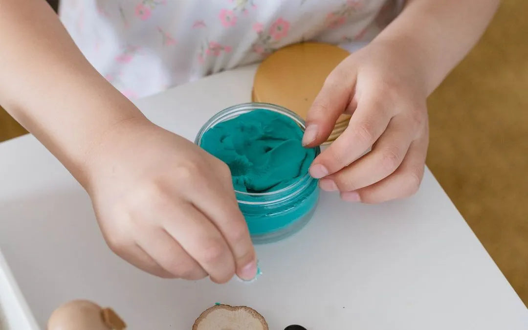 child playing with play dough 