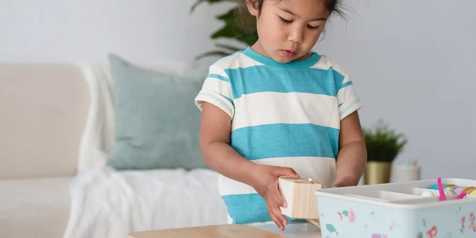 child playing with Meemzy Magic Mermaids Explore Under the Sea sensory bin