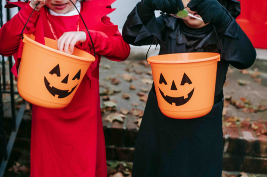 kids wearing halloween costumes and trick-or-treating