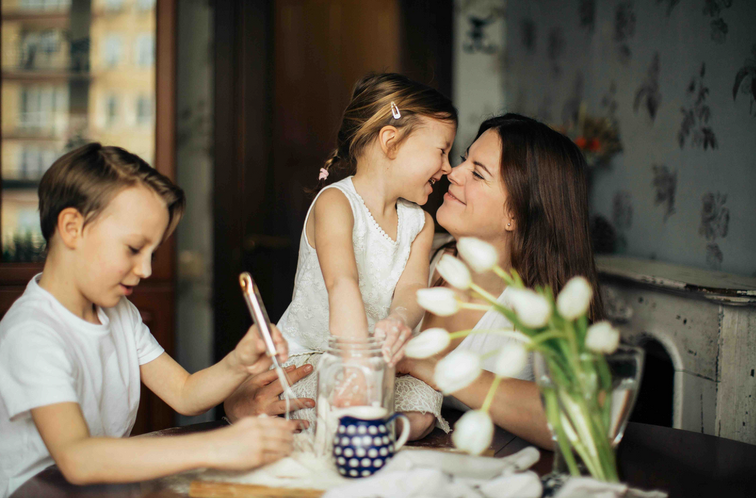 mom painting with her son and daughter