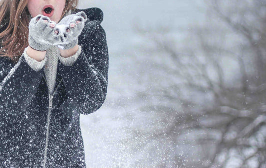 Girl playing in the snow 