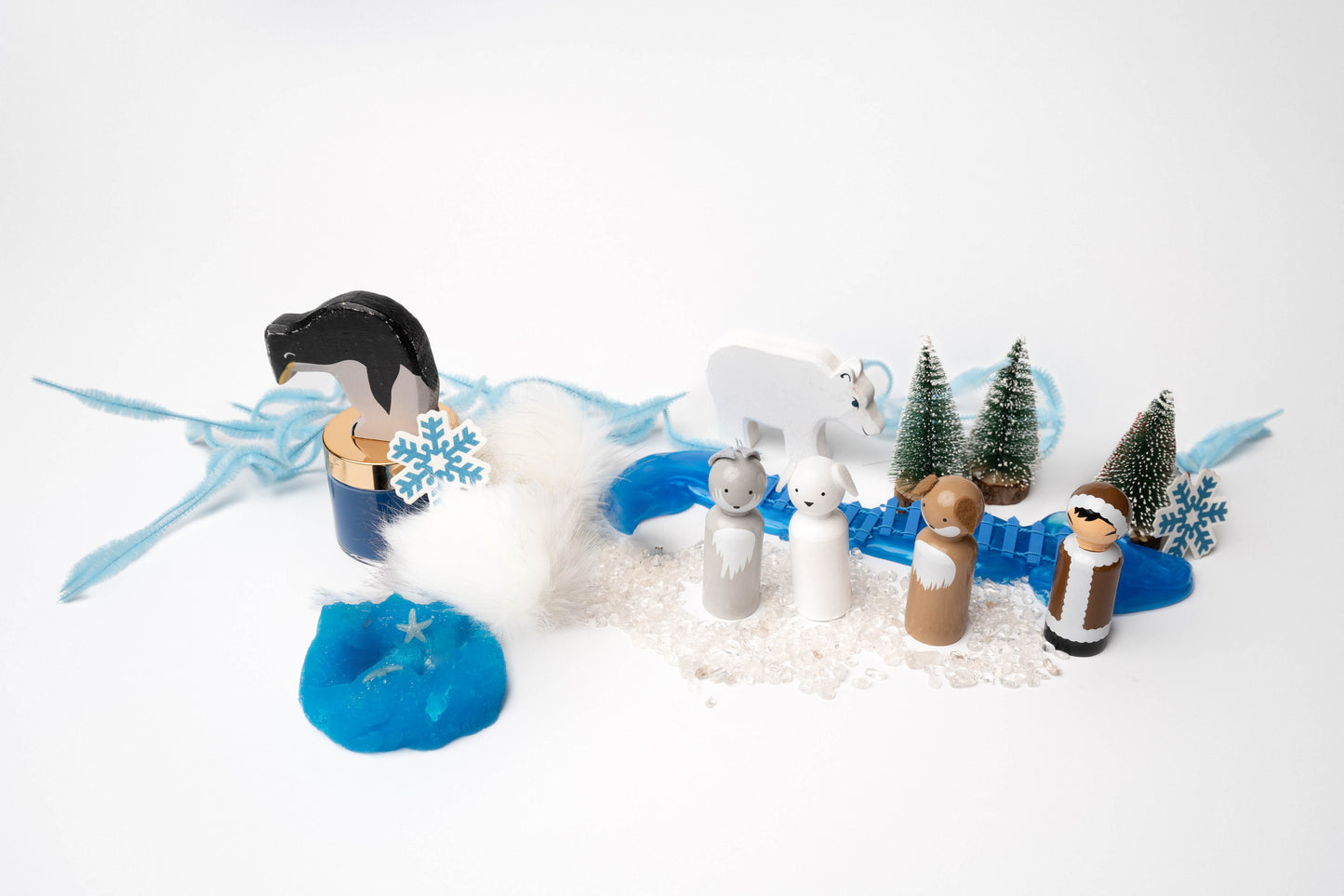 Arctic Adventure kit contents featuring peg dolls, pipe cleaners, play dough and a wood polar bear and penguin