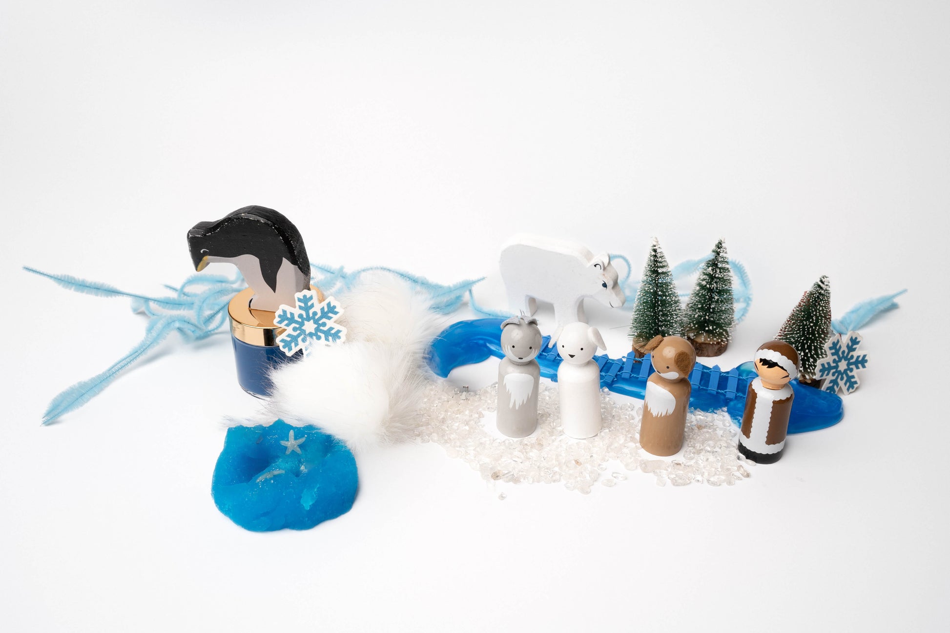 Arctic Adventure kit contents featuring peg dolls, pipe cleaners, play dough and a wood polar bear and penguin