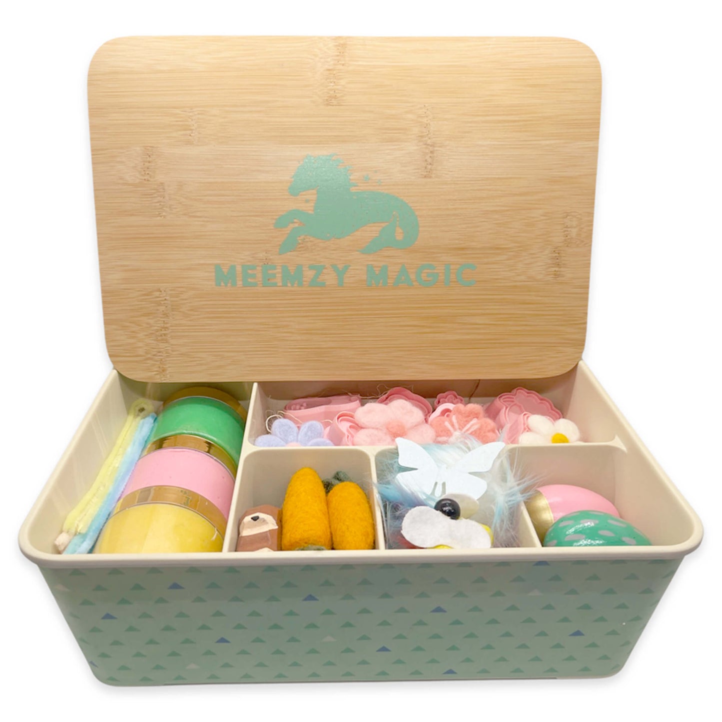 Spring Time sensory kit filled with felt flowers and butter flies, pipe cleaners, felt carrots, wood bunnies, and pastel colored play dough