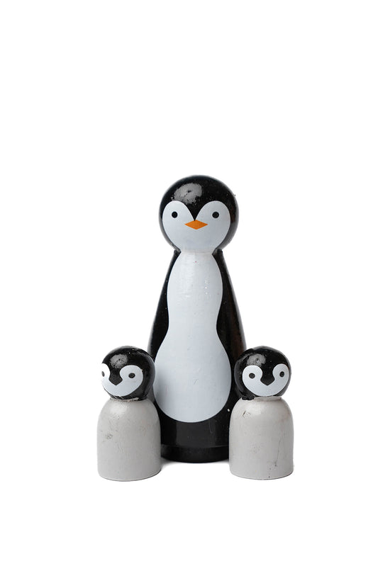 black and white family of penguins. Including mama and her two babies.