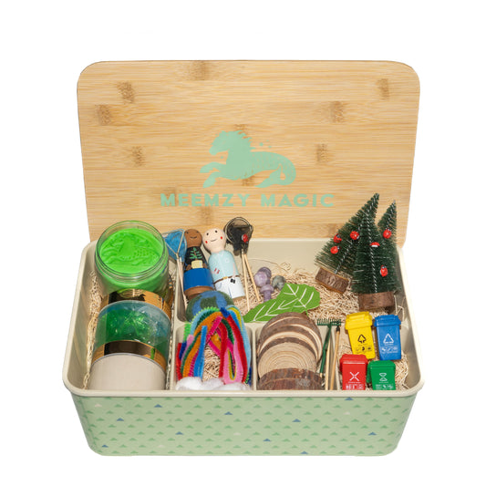 Sensory kit in box showing contents for the planet protector kit including peg dolls, wood rounds, play dough, pipe cleaners, and various mini gardening tools