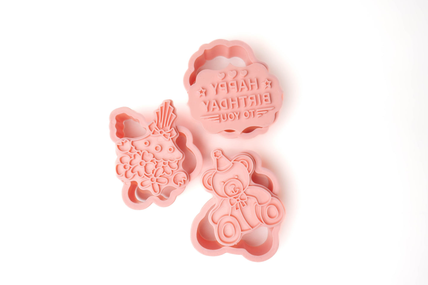 Dough stamps in pink; "happy birthday" and bouquet of flowers and a happy birthday teddy bear stamp