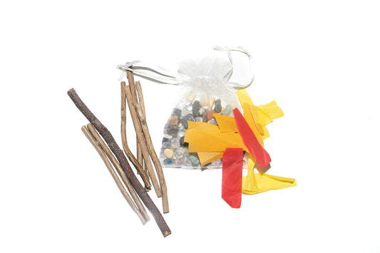 wooden sticks with red, yellow, and orange tissue paper, and natural river rocks for a campfire scene.