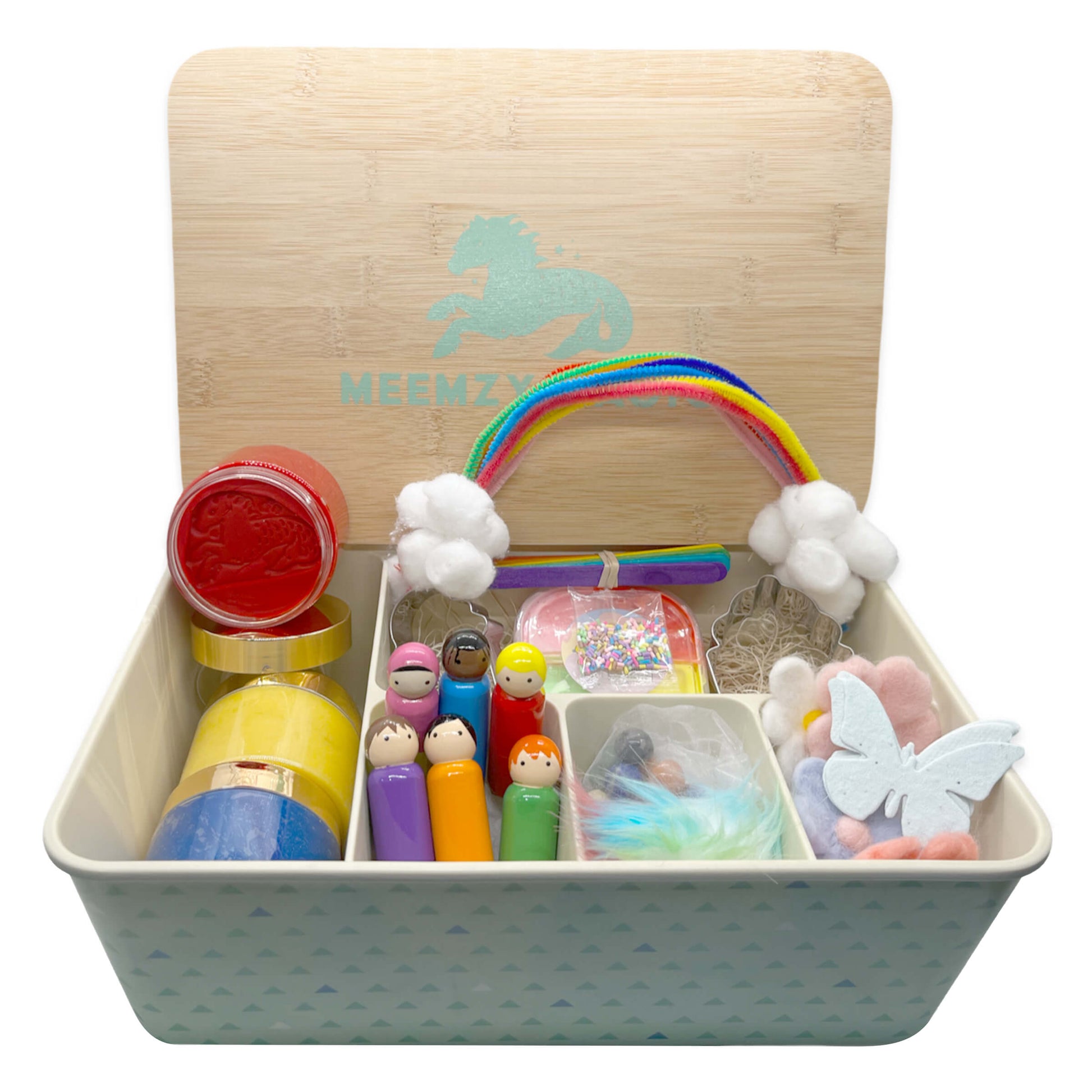 Rainbow Celebration sensory kit in it's box with contents including cotton ball clouds, rainbow pipe cleaners, a variety of colorful play dough, pegs dolls of various colors, and felt flowers and butterflies