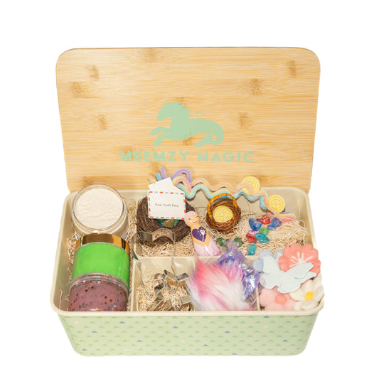 Tooth Fairy sensory kit showing contents including a tooth fairy peg doll, felt flowers, pipe cleaners, and tooth shaped cookie cutter for play dough