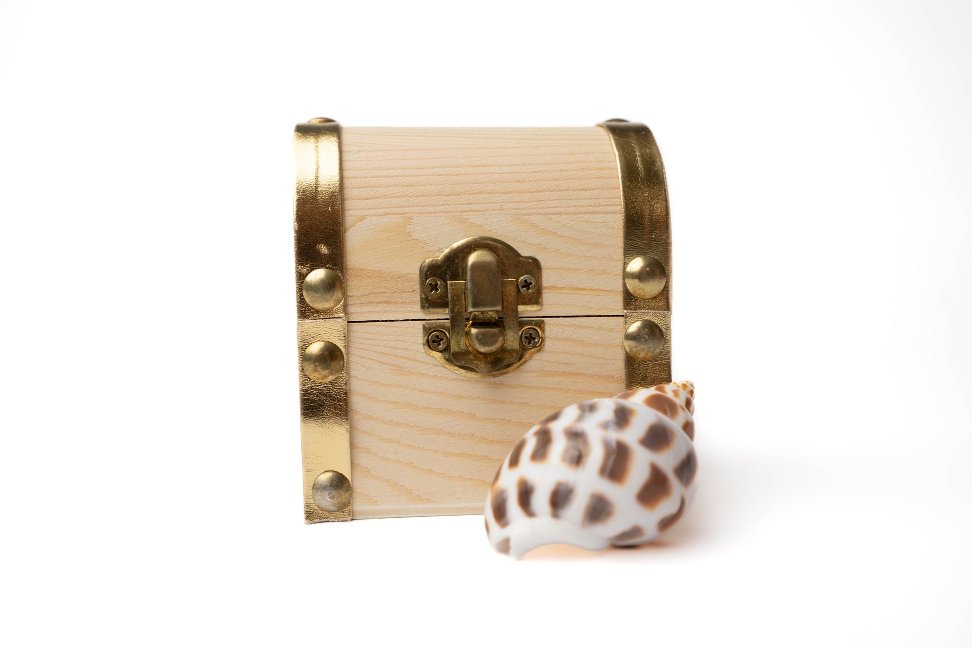 Wooden treasure chest with gold details and gold latch to open and close with conch shell