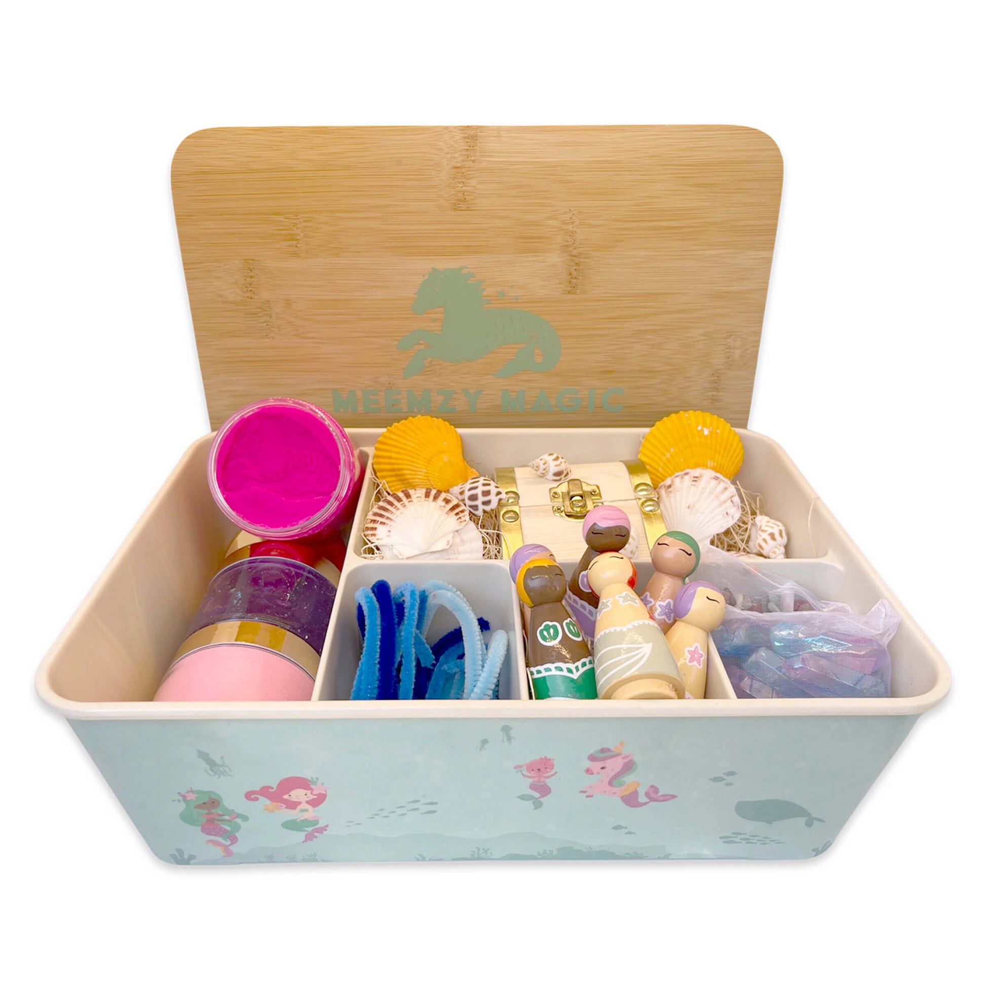 Under the Sea kit featuring shells, play dough, pipe cleaners, colorful crystals, and mermaid peg dolls