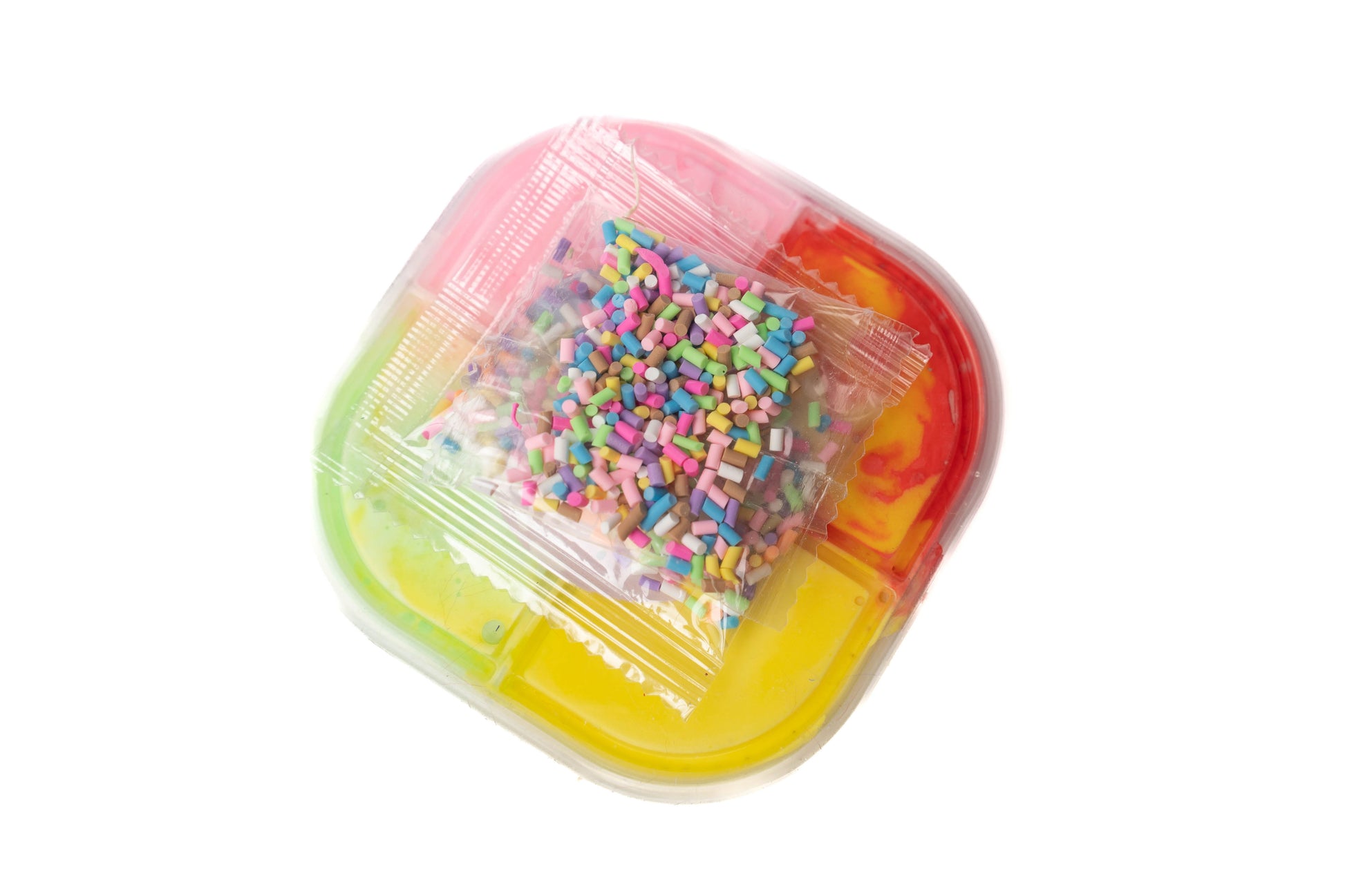 rainbow slime (yellow, red, green, and pink) for mixing with rainbow sprinkles